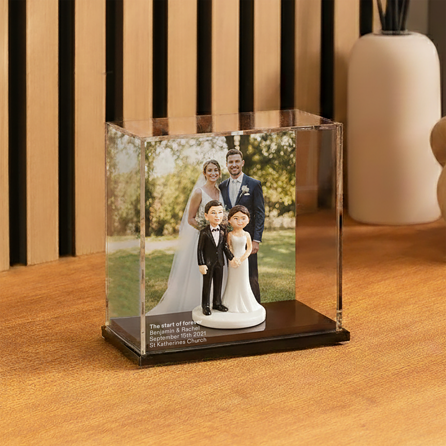 Wedding Memory display case with couple on a wooden floor.
