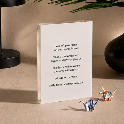 The back of the pet tribute block with a personal printed message: You left paw prints on our hearts forever