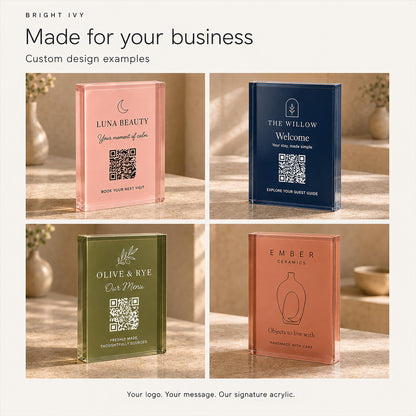 Chart of four custom design examples for the freestanding QR code sign in pink, navy, olive green and terracotta, each with a business logo and message.